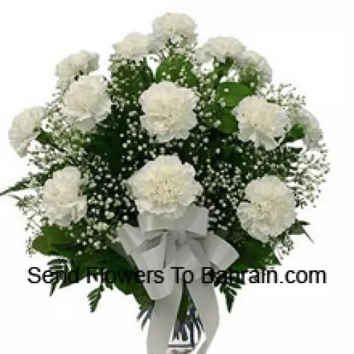 18 White Carnations With Seasonal Fillers In A Glass Vase
