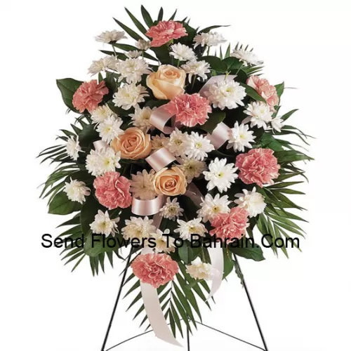 Un bel arrangement floral de condoléances qui vient avec un support (livraison uniquement dans la région métropolitaine de Manille, pour les livraisons en dehors de Manille, le produit peut être substitué par un autre arrangement de condoléances de même valeur)